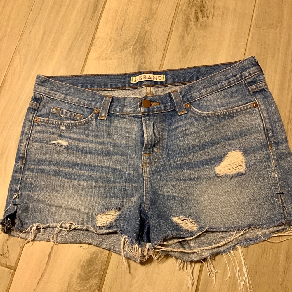 J Brand distressed, cut off jean shirts.